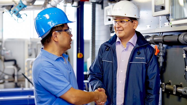 Endress+Hauser service engineer with a plant manager of a chemical plant